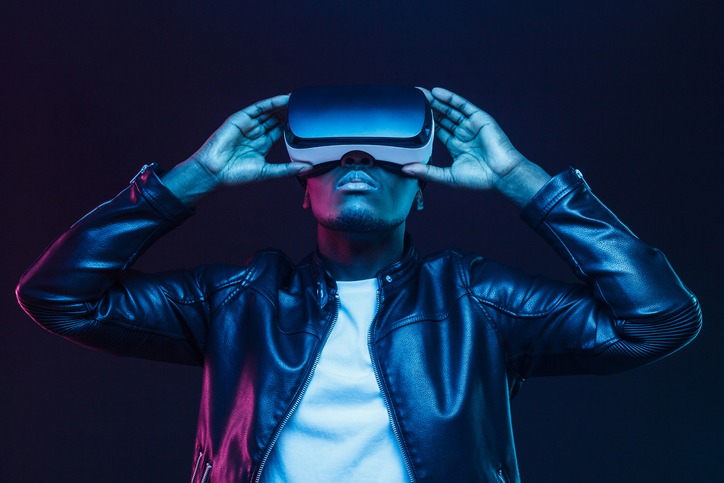 African american man in vr glasses, watching 360 degree video with virtual reality headset isolated on black background