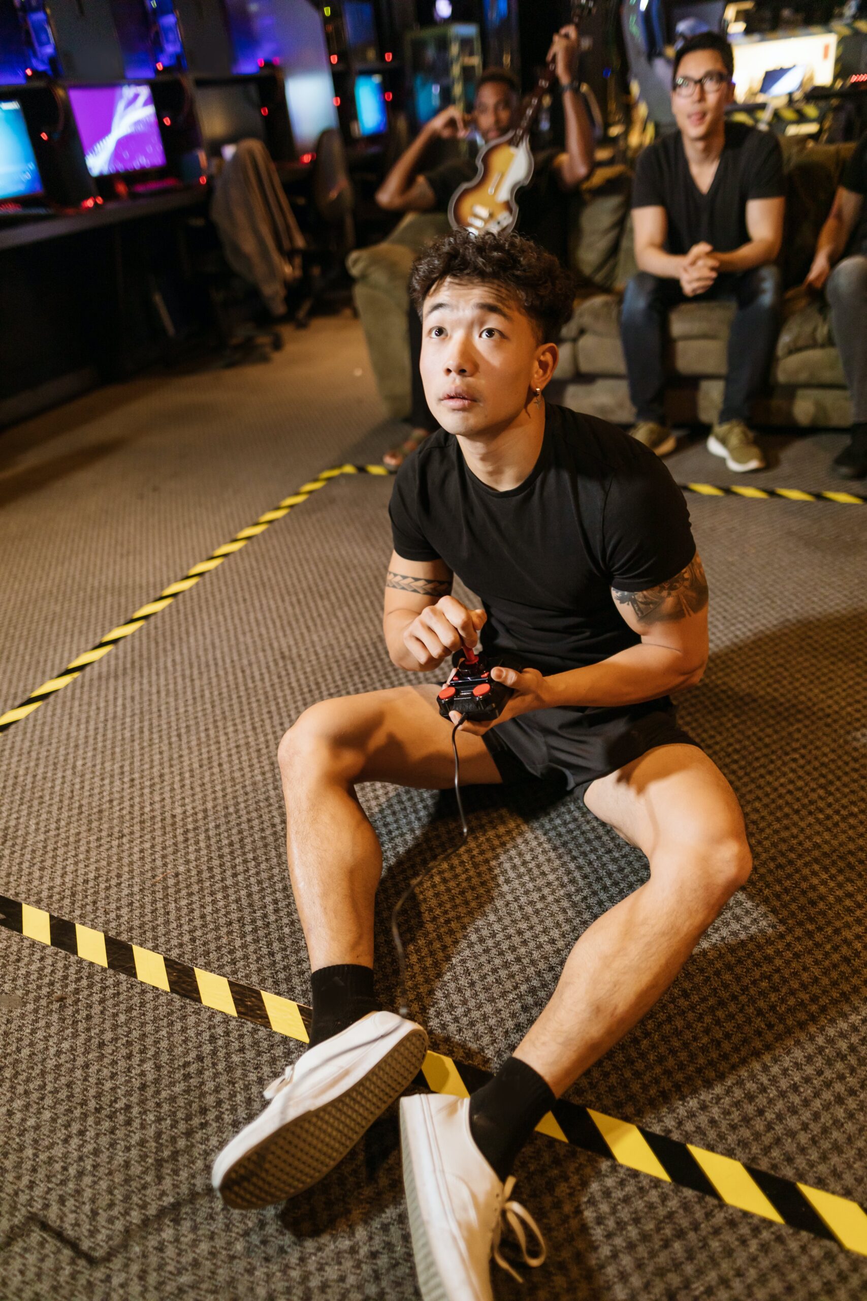 man in black shirt playing video game