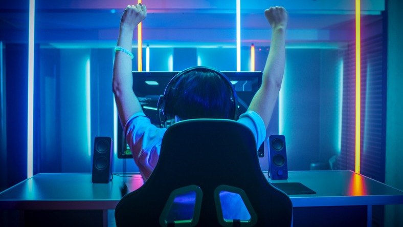 Gamer enjoy winning video game at home